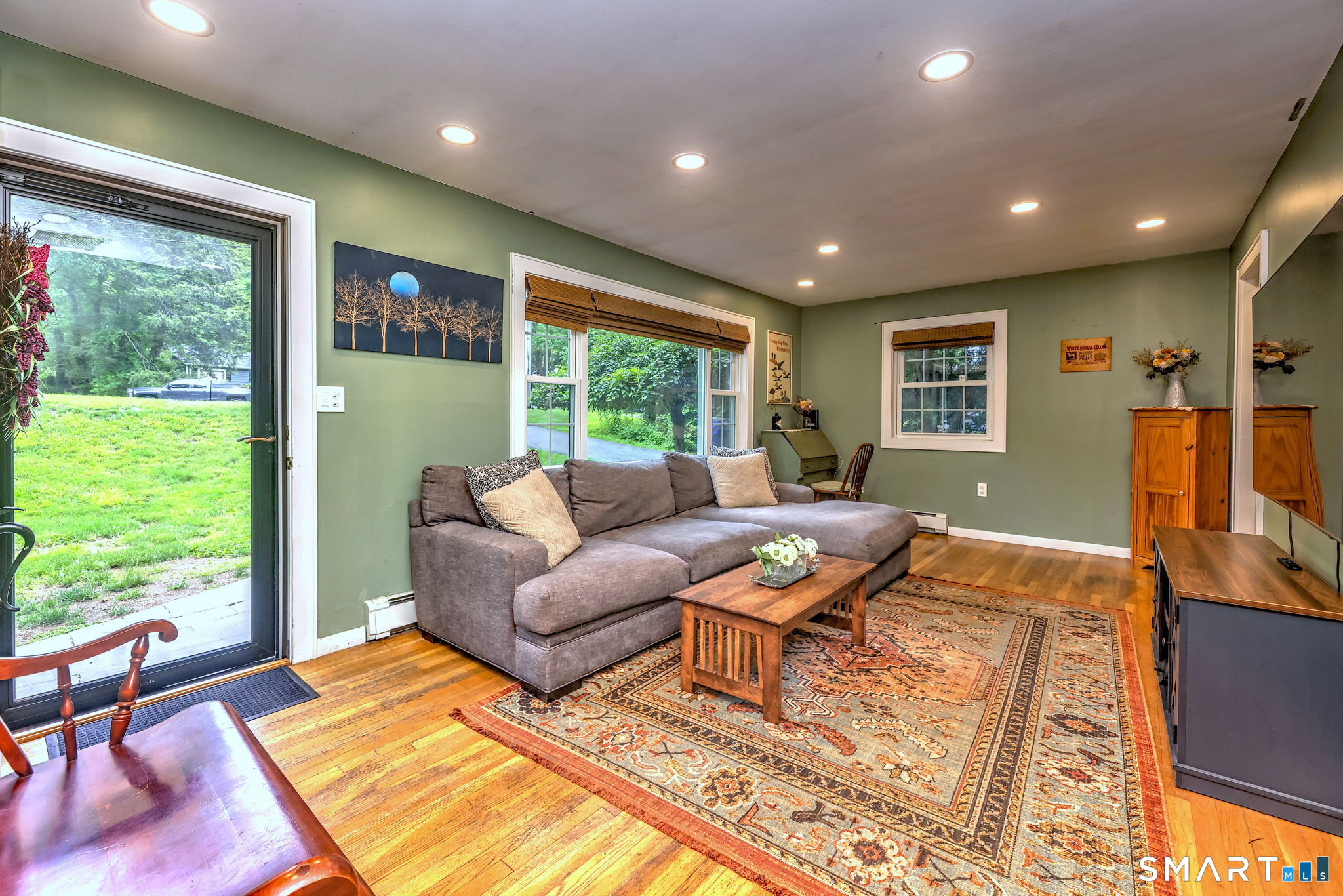 265 Shelter Rock Road Fairfield, CT 06825 - Photo 3 of 32 Enter through the front door into the sun-filled living room, with recessed lights and hardwood flooring.