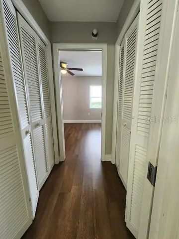 a spacious bathroom with a toilet sink and a mirror