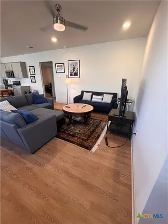 a living room with furniture and a window