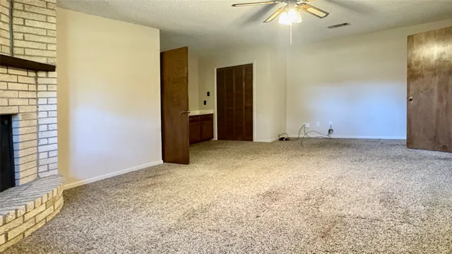 an empty room with a bathroom