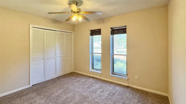 a building outdoor space with patio furniture and potted plants