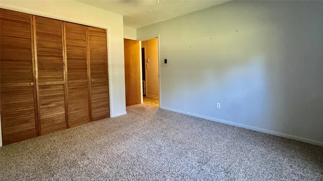 a view of a large yard with a large trees