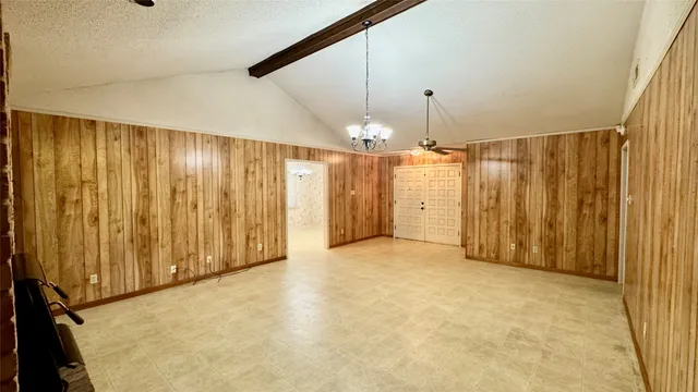 a view of a hallway with a chandelier