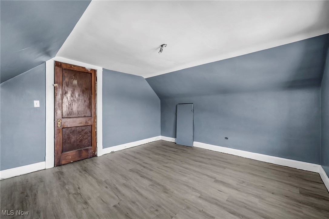 1854 Grantham Road Cleveland, OH 44112 - Photo 28 of 47 Bonus room featuring wood finished floors and vaulted ceiling