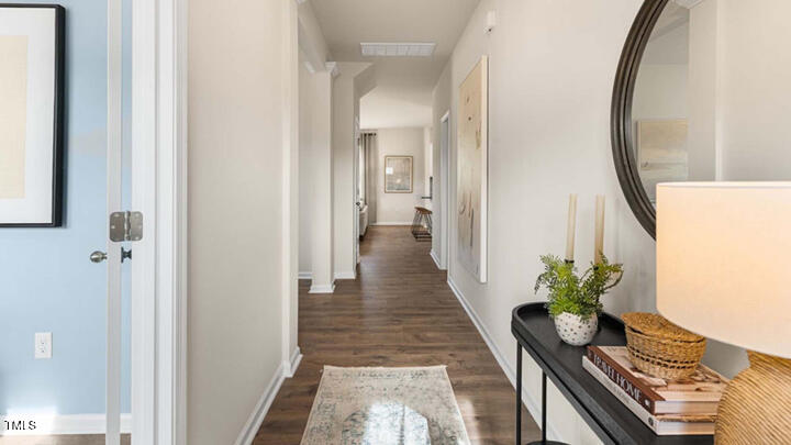1217 Pavo Path Wendell, NC 27591 - Photo 4 of 50 a view of a hallway with wooden floor and glass door
