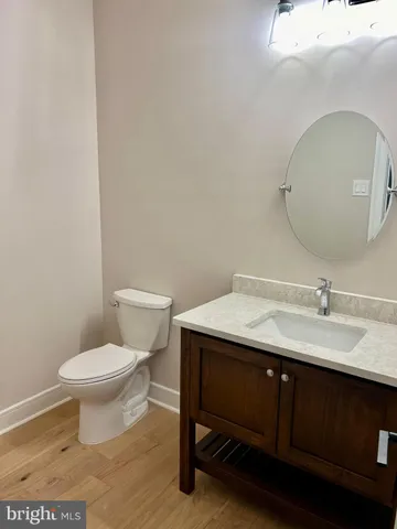 a bath tub sitting in a bathroom next to a window