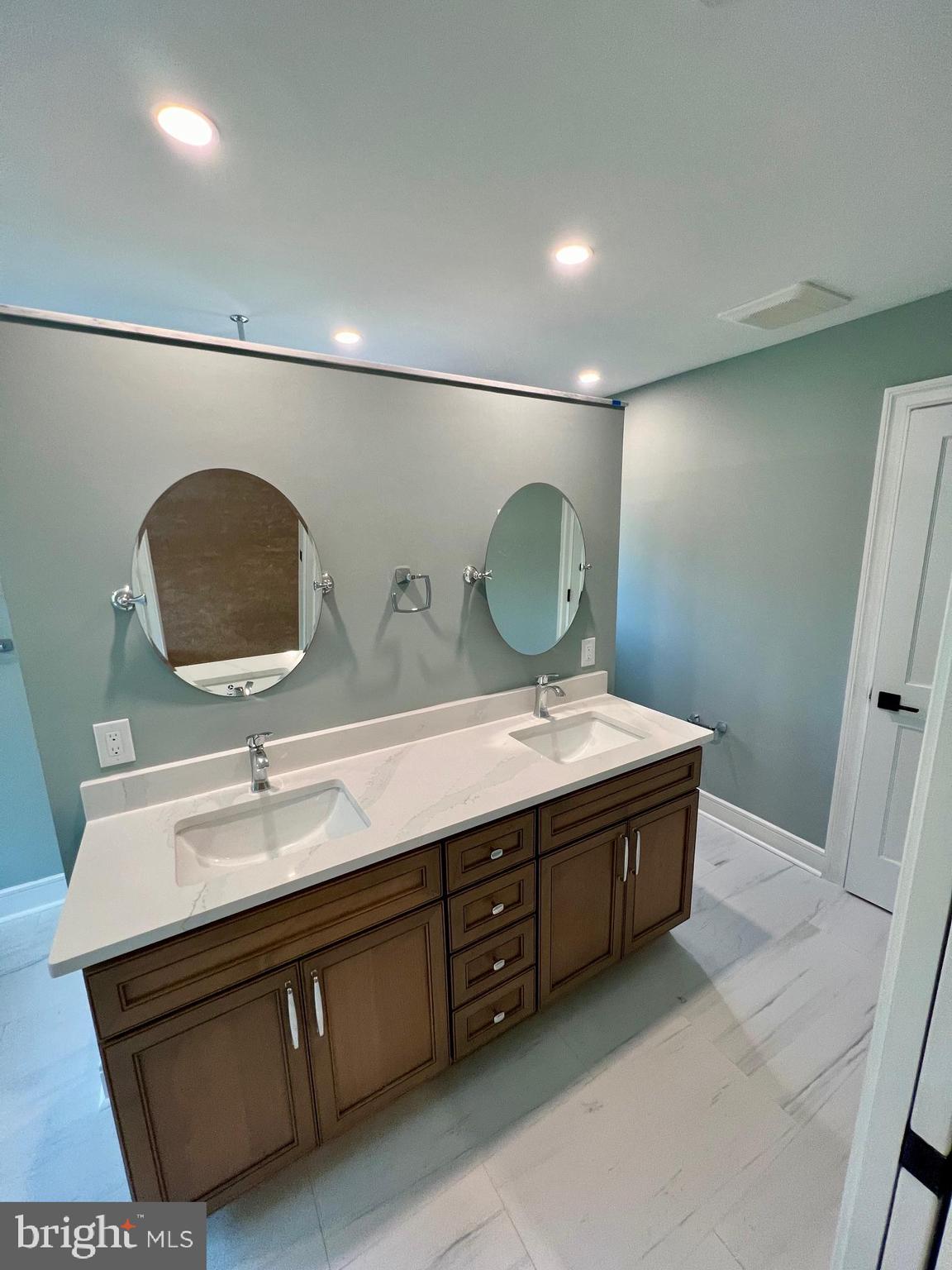 11 2nd Street Chatsworth, NJ 08019 - Photo 20 of 85 a bathroom with a double vanity sink and a mirror