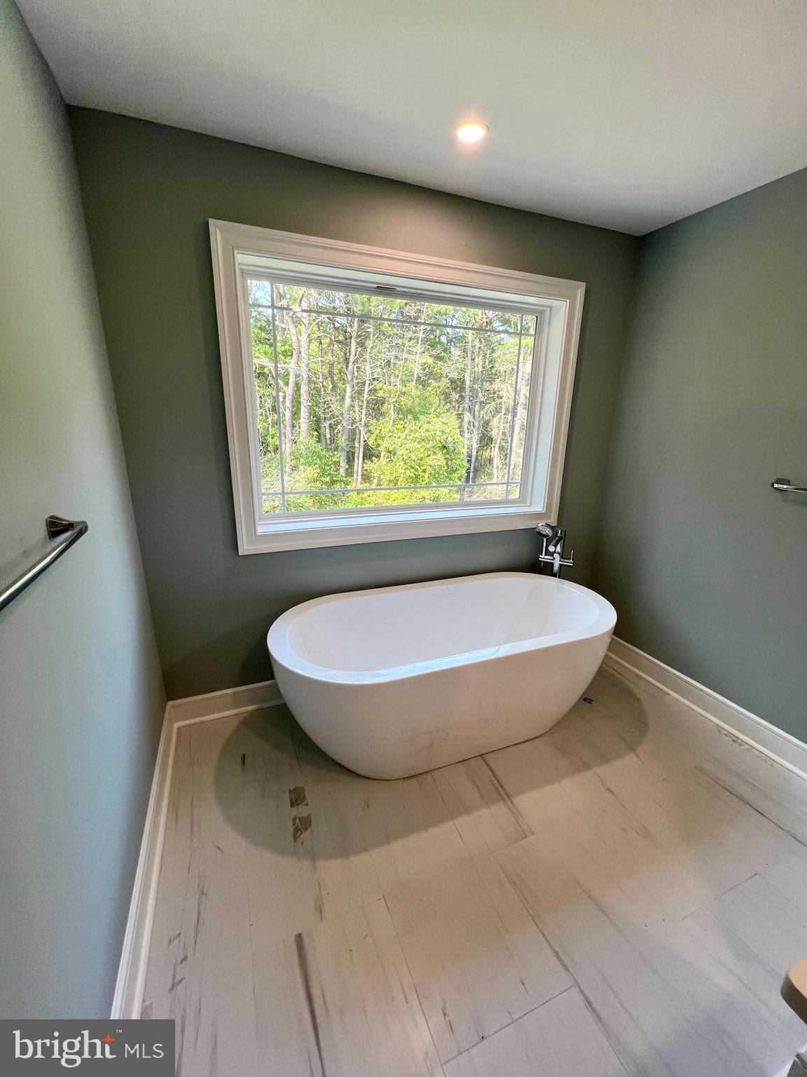 11 2nd Street Chatsworth, NJ 08019 - Photo 21 of 85 a view of a room with a wooden floor and a window