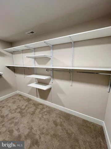 a front view of a house with a yard table and chairs