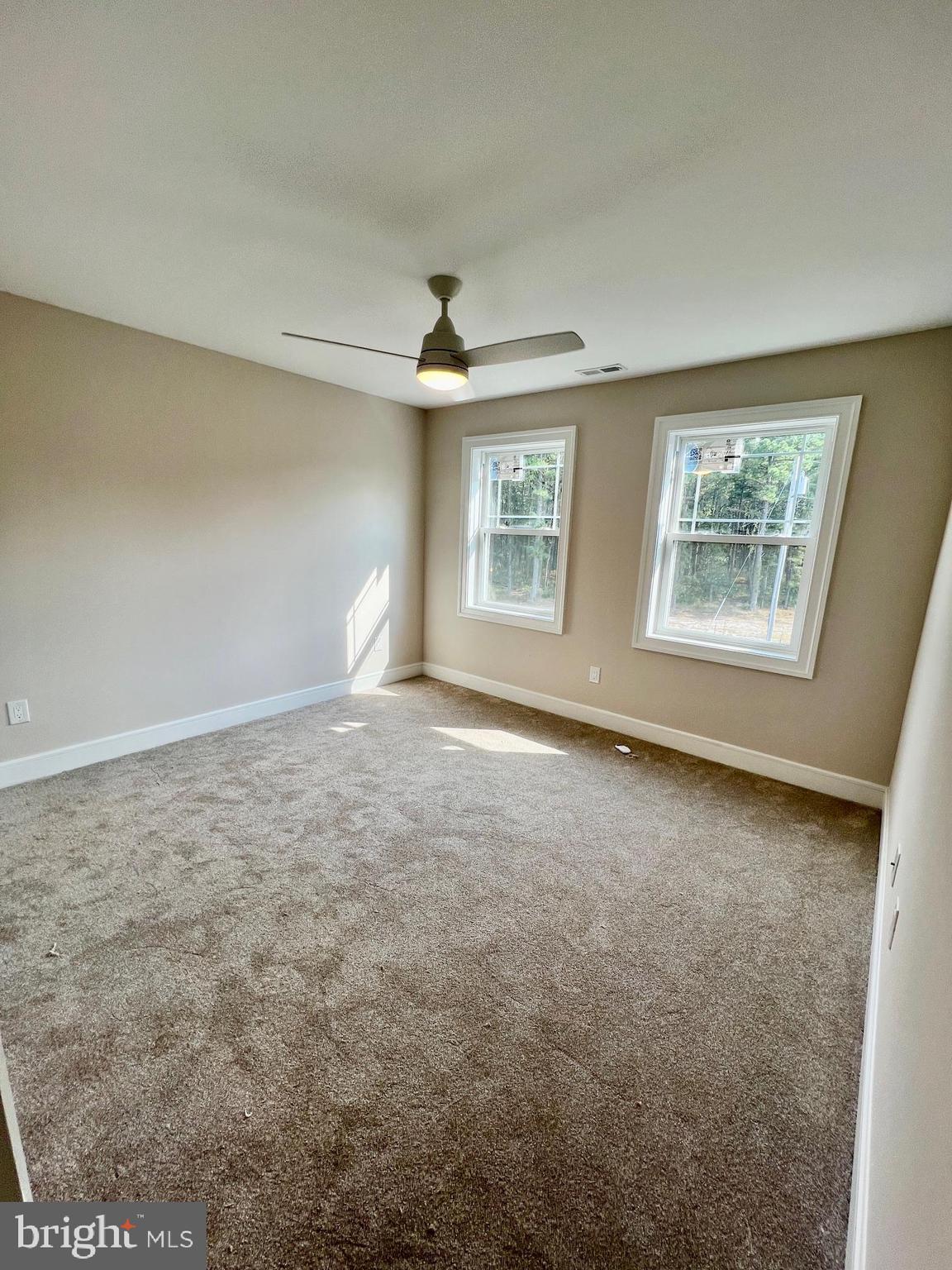 11 2nd Street Chatsworth, NJ 08019 - Photo 29 of 85 an empty room with windows and ceiling fan
