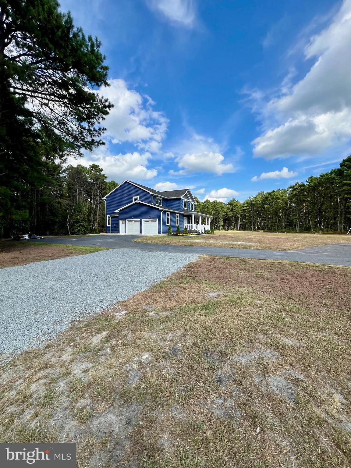 11 2nd Street Chatsworth, NJ 08019 - Photo 4 of 85 a view of house with outdoor space and trees in the background