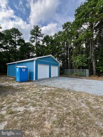 a large kitchen with kitchen island a sink stainless steel appliances and cabinets