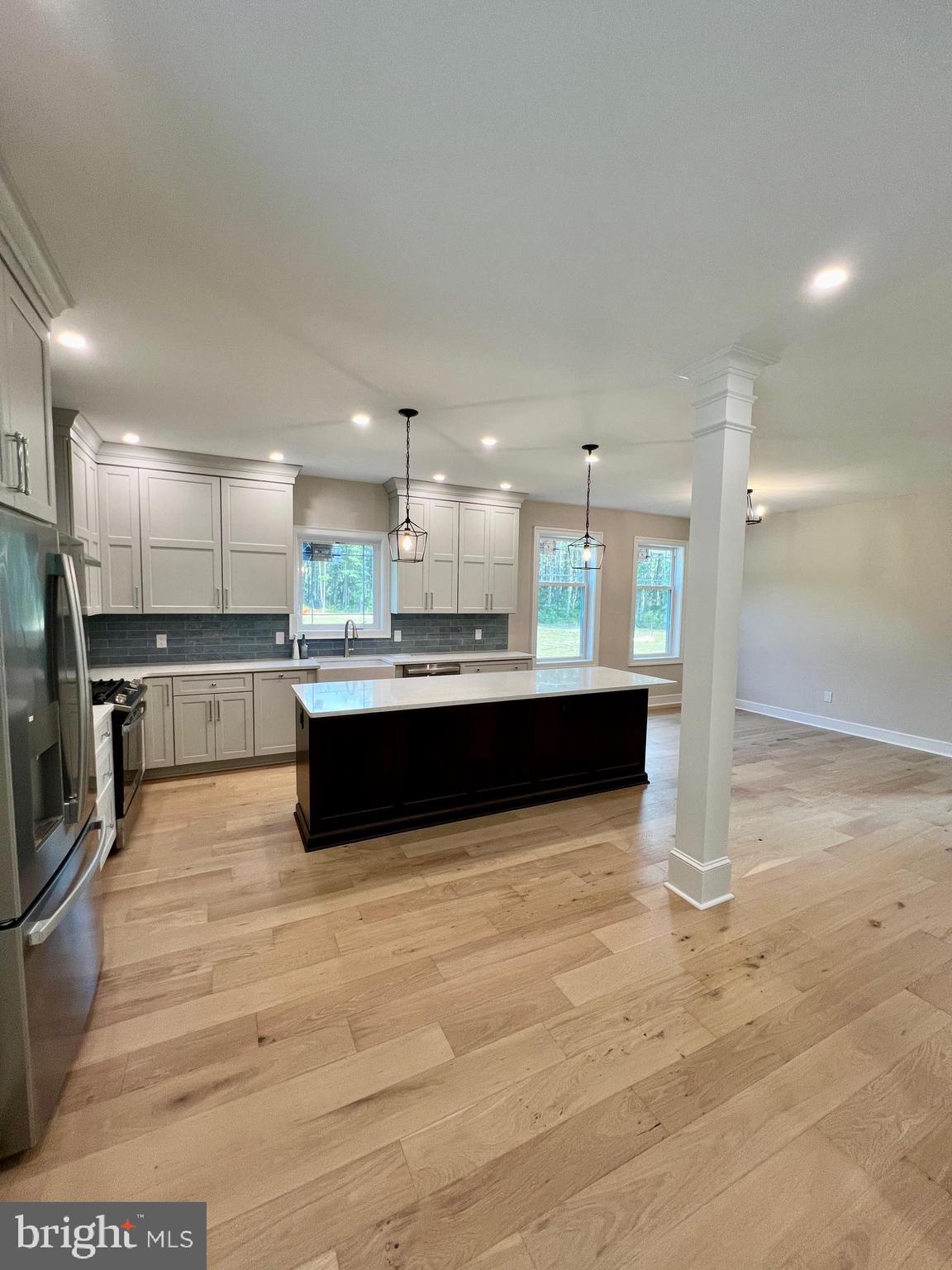11 2nd Street Chatsworth, NJ 08019 - Photo 8 of 85 a large kitchen with kitchen island a sink stainless steel appliances and cabinets