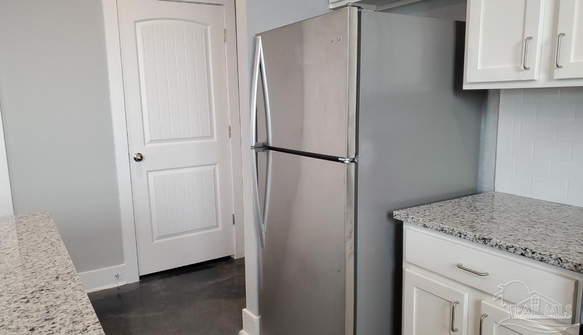 9822 Utopia Drive, Unit E Pensacola, FL 32514 - Photo 8 of 13 a view of cabinets