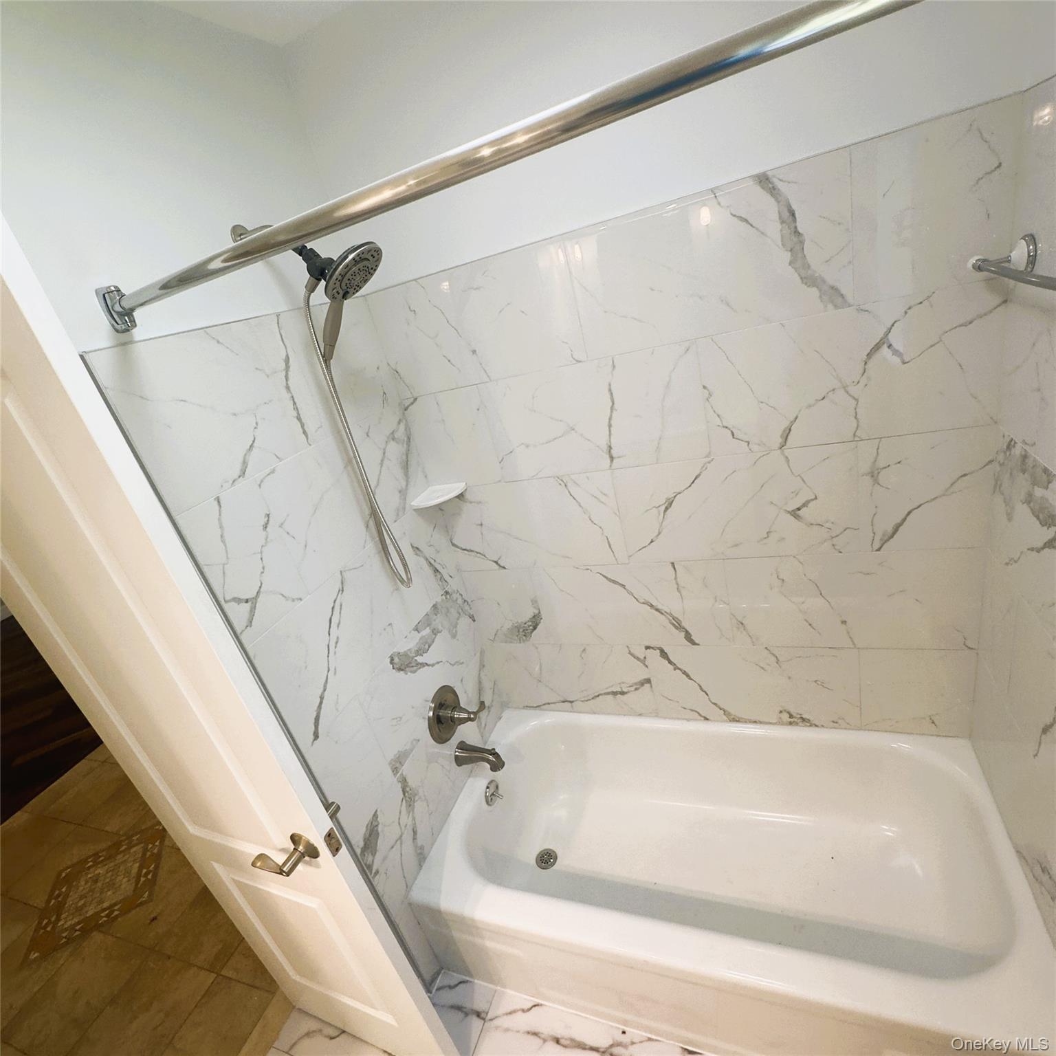 26 Cooper, Unit 603 Poughkeepsie, NY 12603 - Photo 13 of 15 a bathroom with a shower and a bathtub