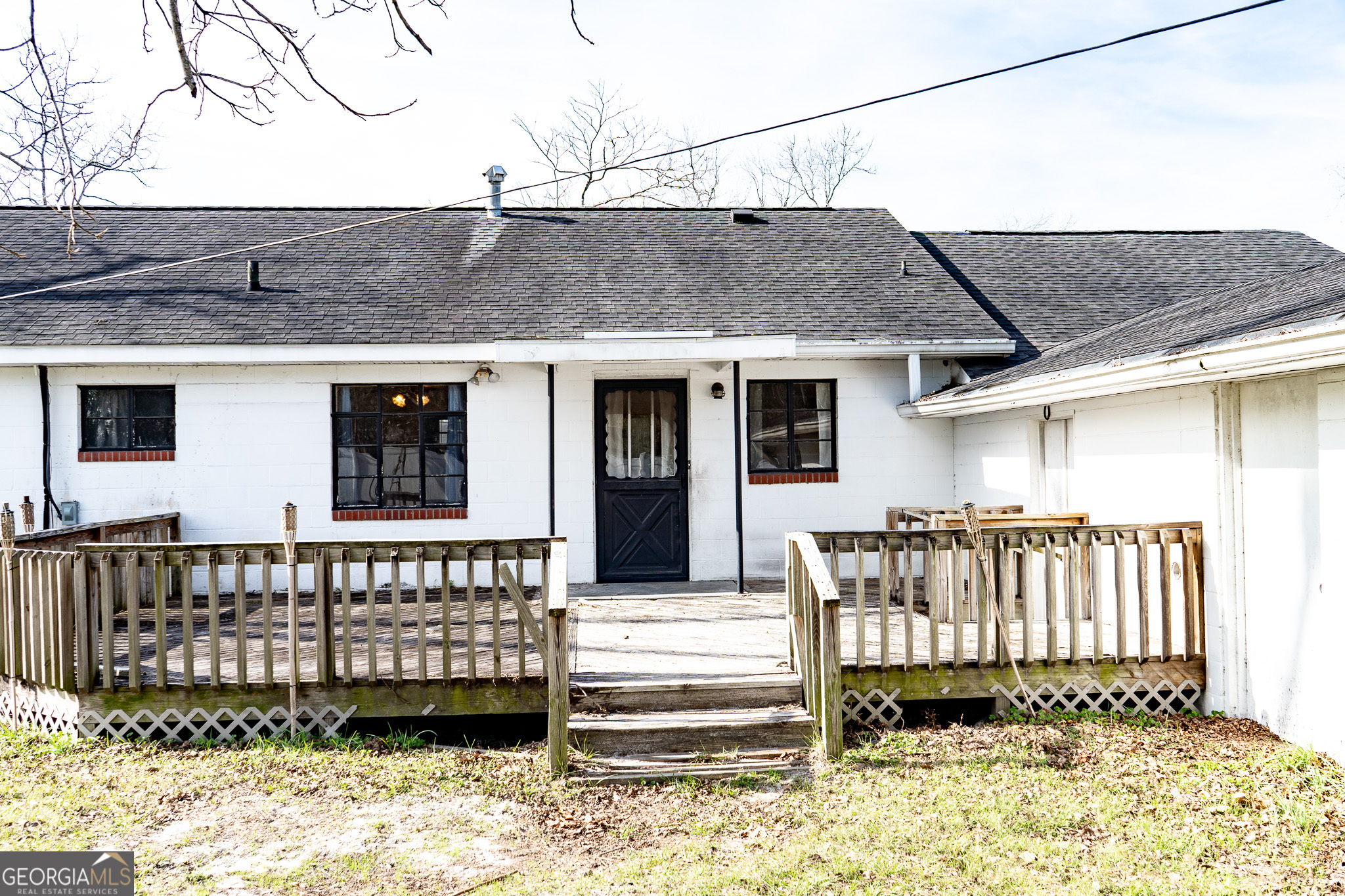 1615 Brunel Street Waycross, GA 31501 - Photo 18 of 28 a view of a house with a wooden deck