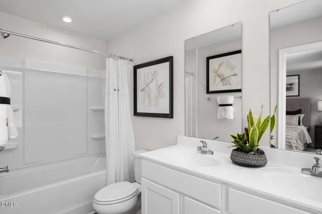 a bathroom with a sink a toilet and a bathtub