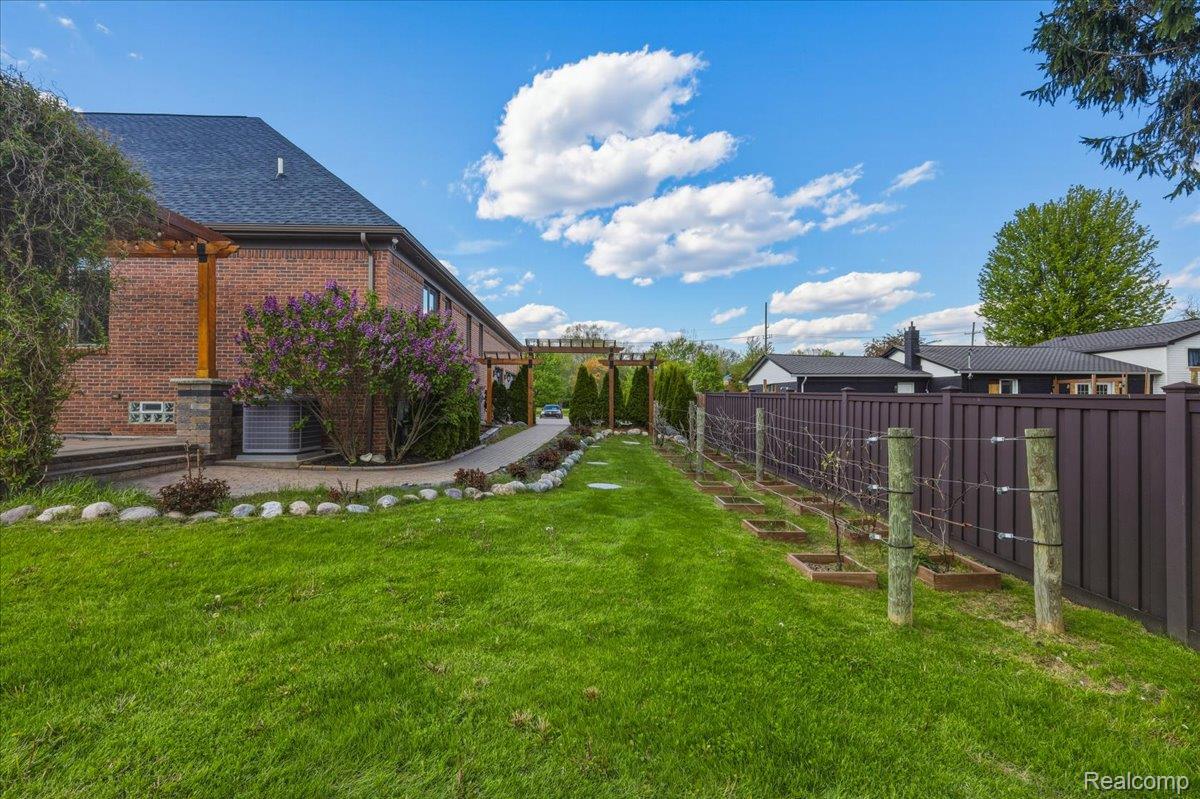 35339 West 13 Mile Road Farmington, MI 48331 - Photo 61 of 72 Fenced backyard with a garden