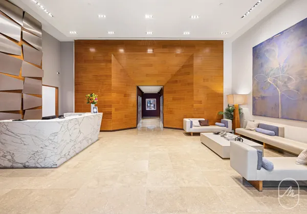 a living room with fireplace furniture and a flat screen tv