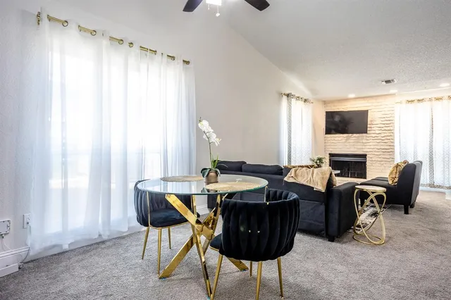 a view of a livingroom with furniture and a fireplace