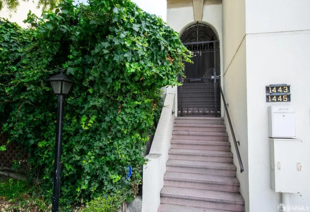 a view of entryway with wooden stairs