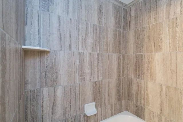 a bathroom with a granite countertop sink mirror and a