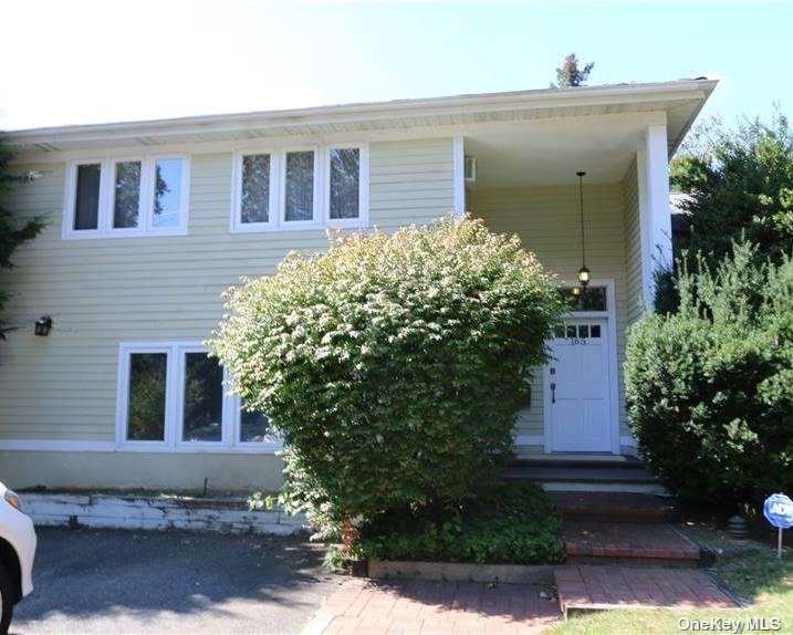 165 Cold Spring Road Syosset, NY 11791 - Photo 1 of 1 a front view of a house with plants