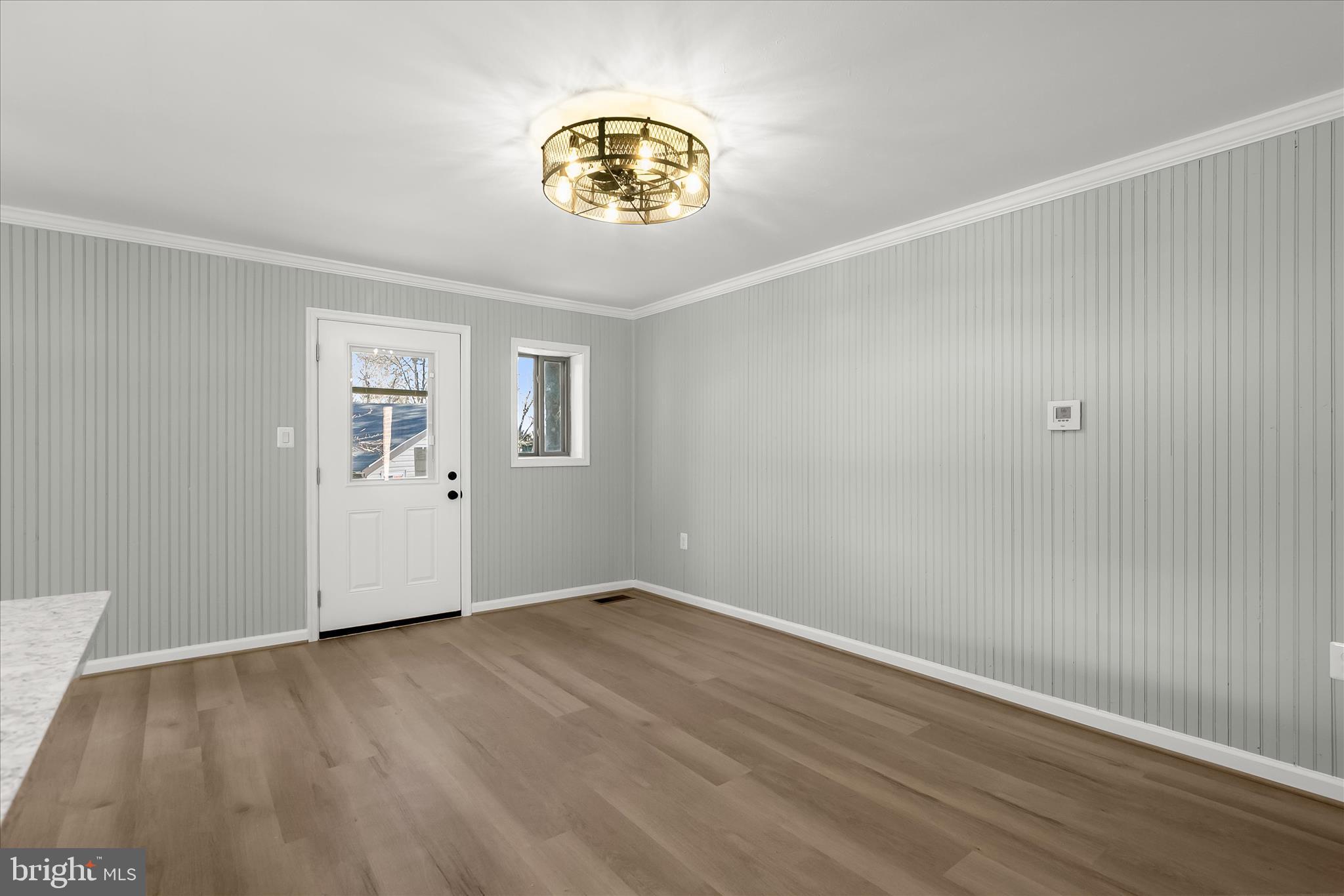 9511 Wandering Way Columbia, MD 21045 - Photo 21 of 62 wooden floor in an empty room with a window