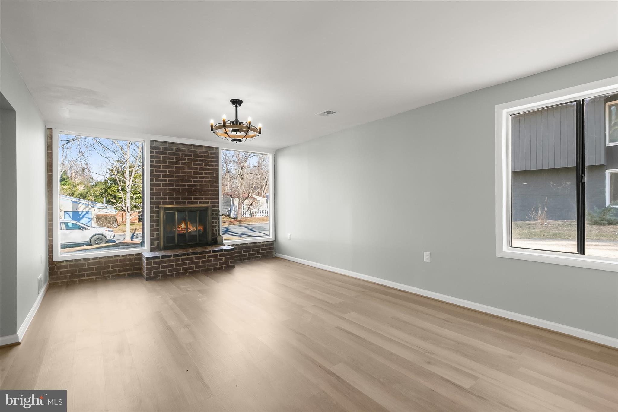 9511 Wandering Way Columbia, MD 21045 - Photo 26 of 62 a view of an empty room with a window and fireplace