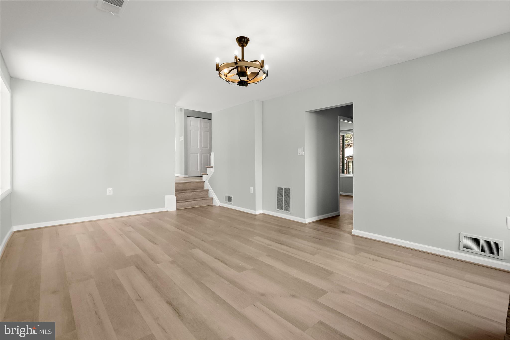 9511 Wandering Way Columbia, MD 21045 - Photo 28 of 62 a view of empty room with wooden floor