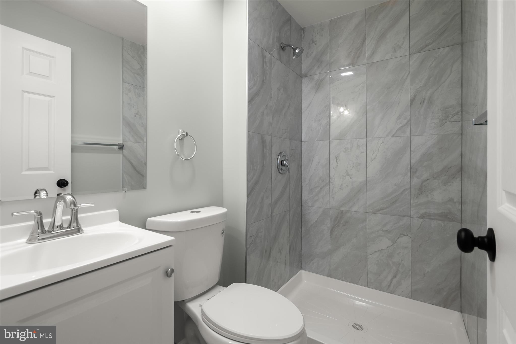 9511 Wandering Way Columbia, MD 21045 - Photo 30 of 62 a bathroom with a sink a toilet and shower
