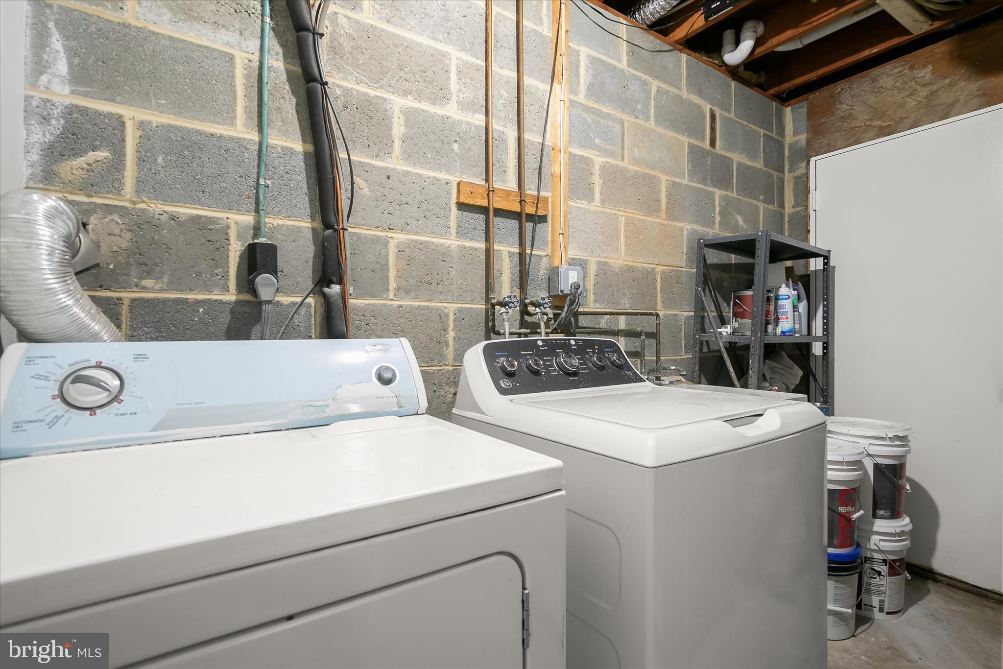 9511 Wandering Way Columbia, MD 21045 - Photo 37 of 62 a utility room with dryer and washer