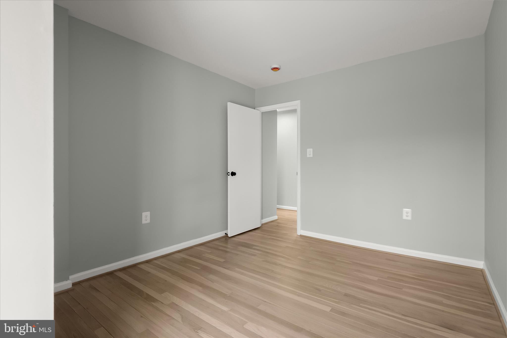 9511 Wandering Way Columbia, MD 21045 - Photo 44 of 62 a view of an empty room with wooden floor