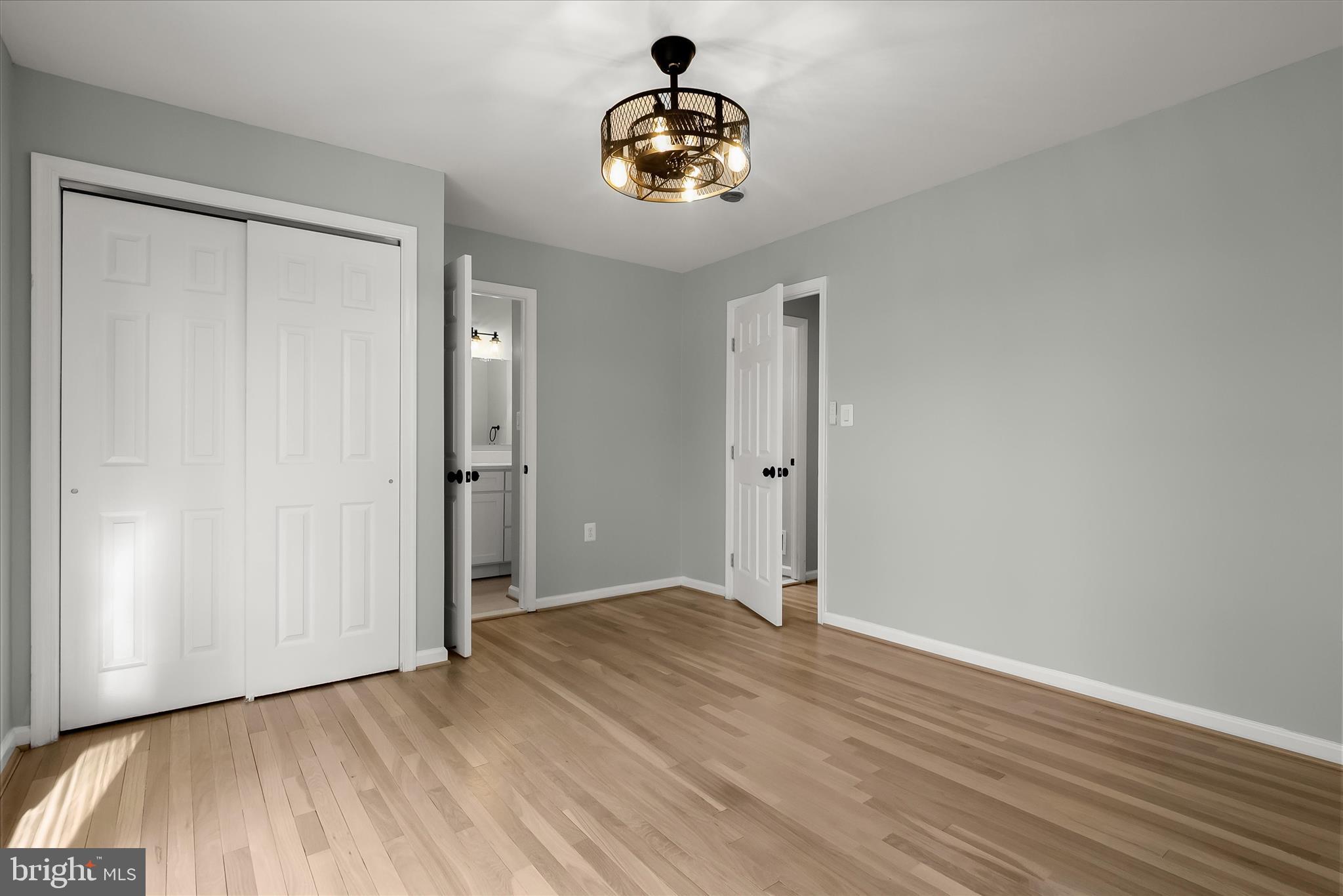9511 Wandering Way Columbia, MD 21045 - Photo 49 of 62 an empty room with wooden floor and windows