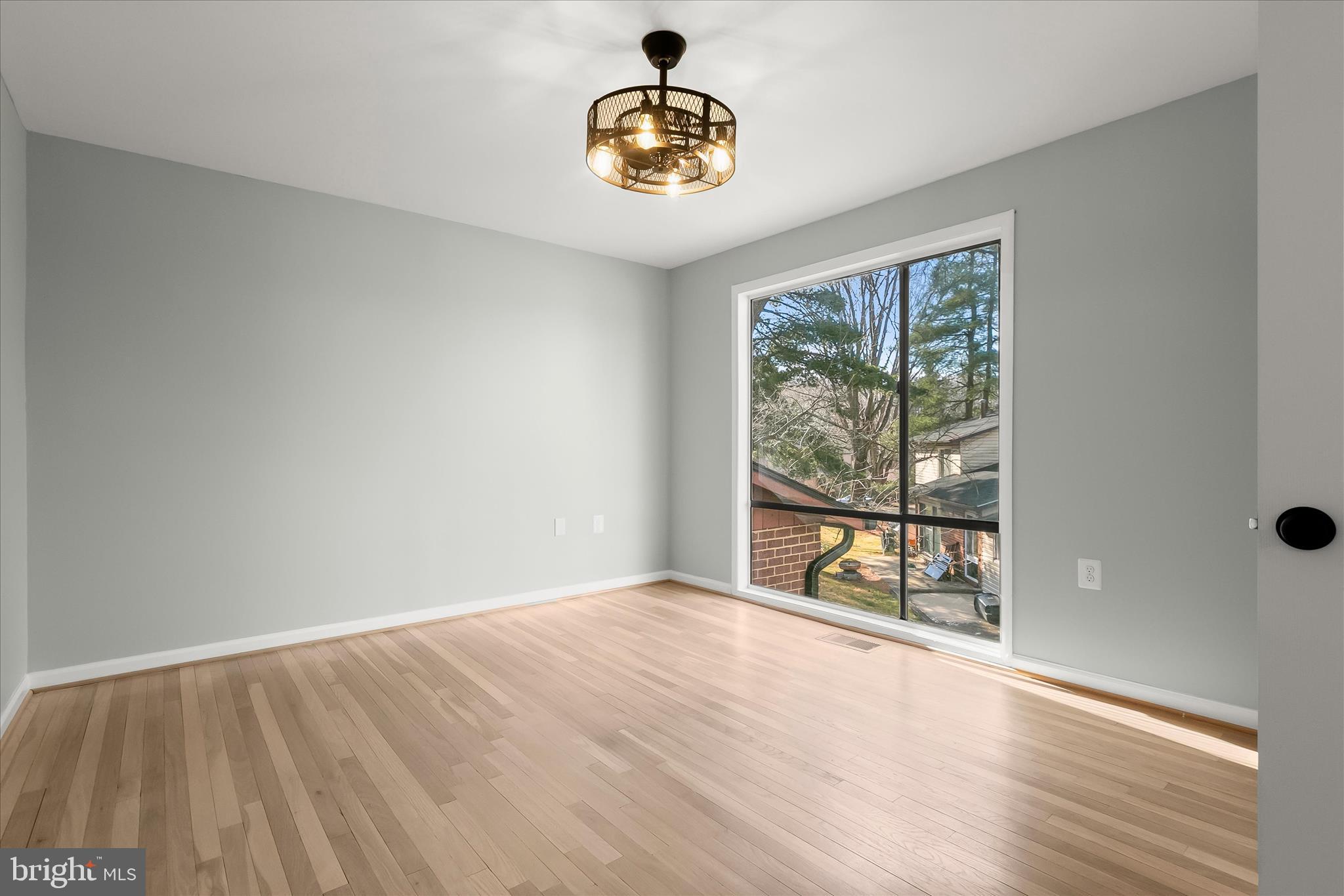 9511 Wandering Way Columbia, MD 21045 - Photo 51 of 62 wooden floor in an empty room with a window