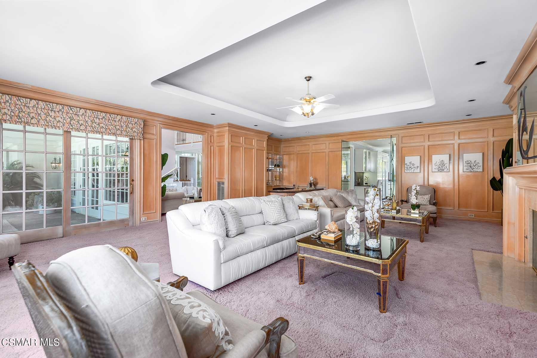 5467 Wellesley Drive Calabasas, CA 91302 - Photo 17 of 60 a living room with furniture and a large window