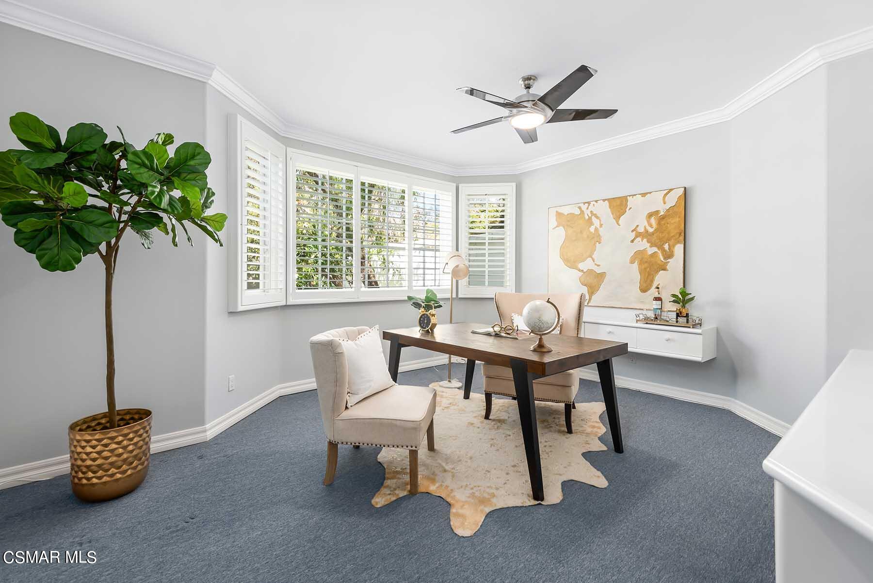 5467 Wellesley Drive Calabasas, CA 91302 - Photo 24 of 60 a living room with furniture and a potted plant