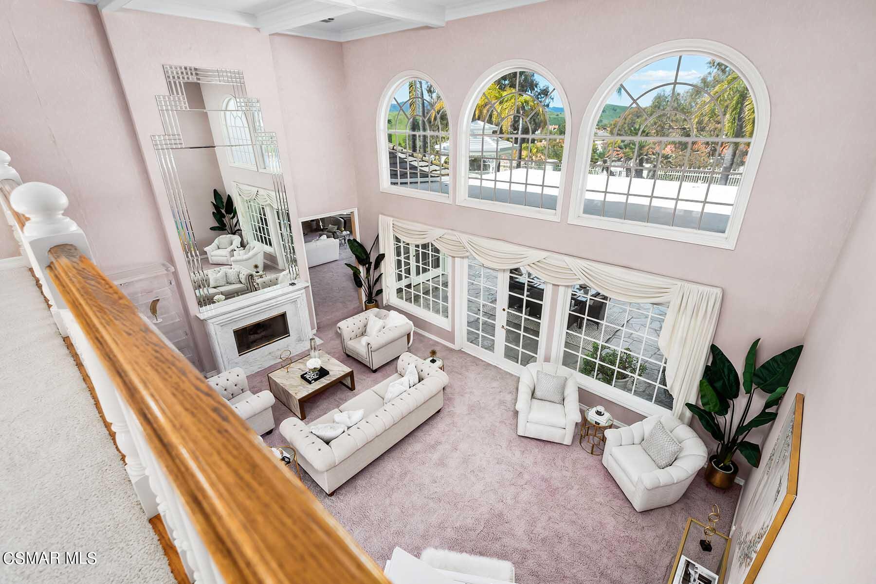 5467 Wellesley Drive Calabasas, CA 91302 - Photo 29 of 60 a living room with furniture and a floor to ceiling window