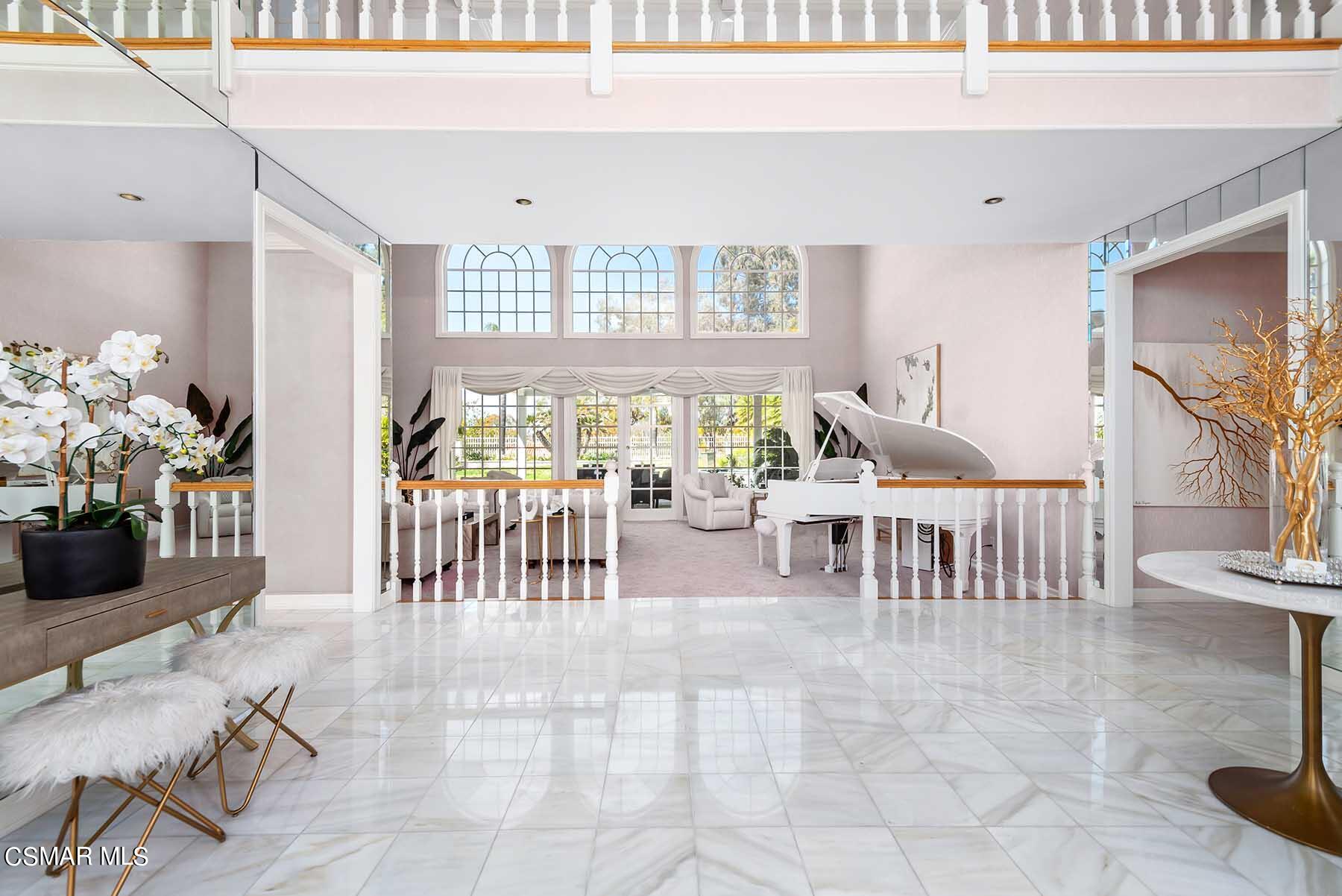 5467 Wellesley Drive Calabasas, CA 91302 - Photo 3 of 60 a dining room with furniture and a floor to ceiling window