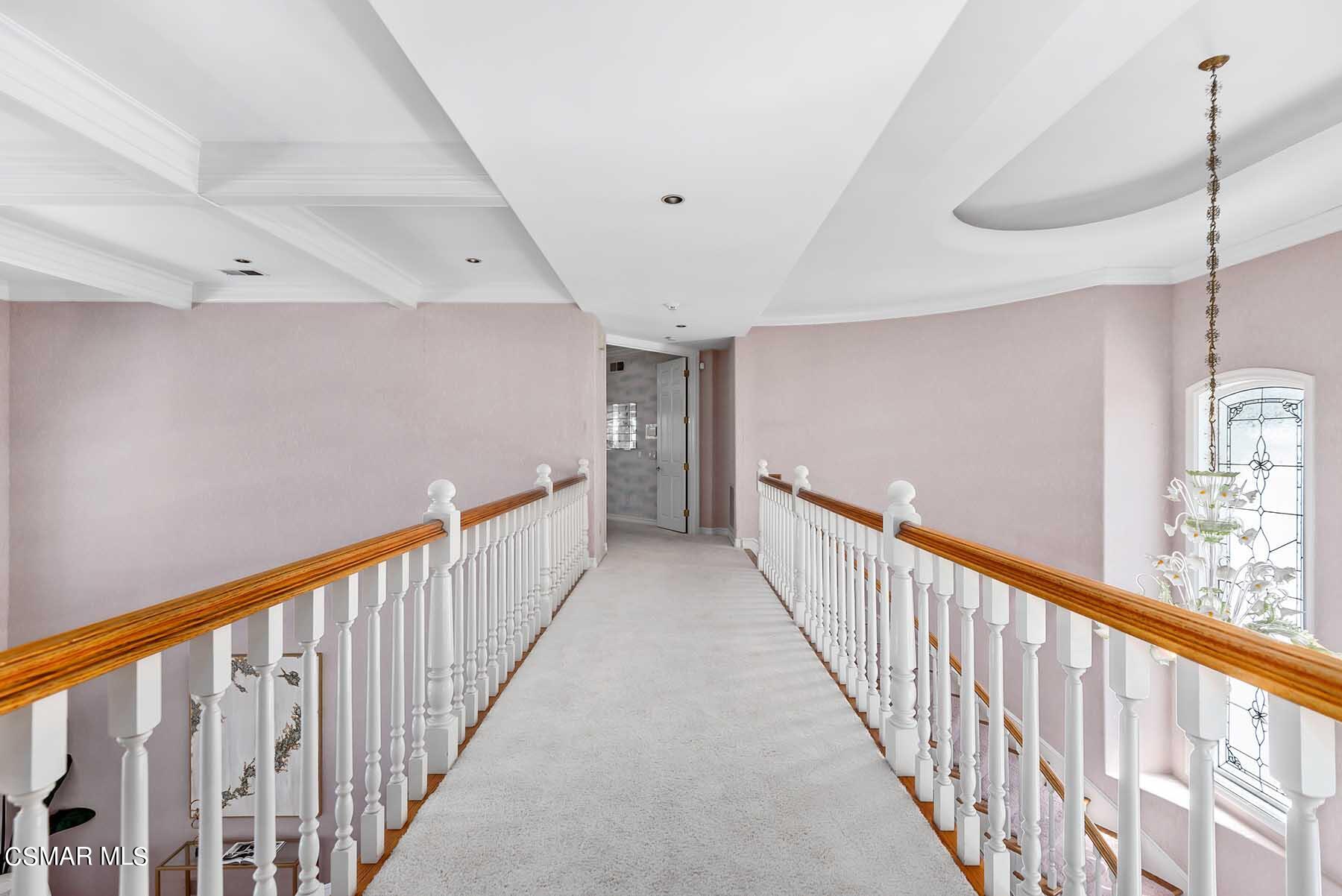 5467 Wellesley Drive Calabasas, CA 91302 - Photo 31 of 60 a view of a hallway with stairs