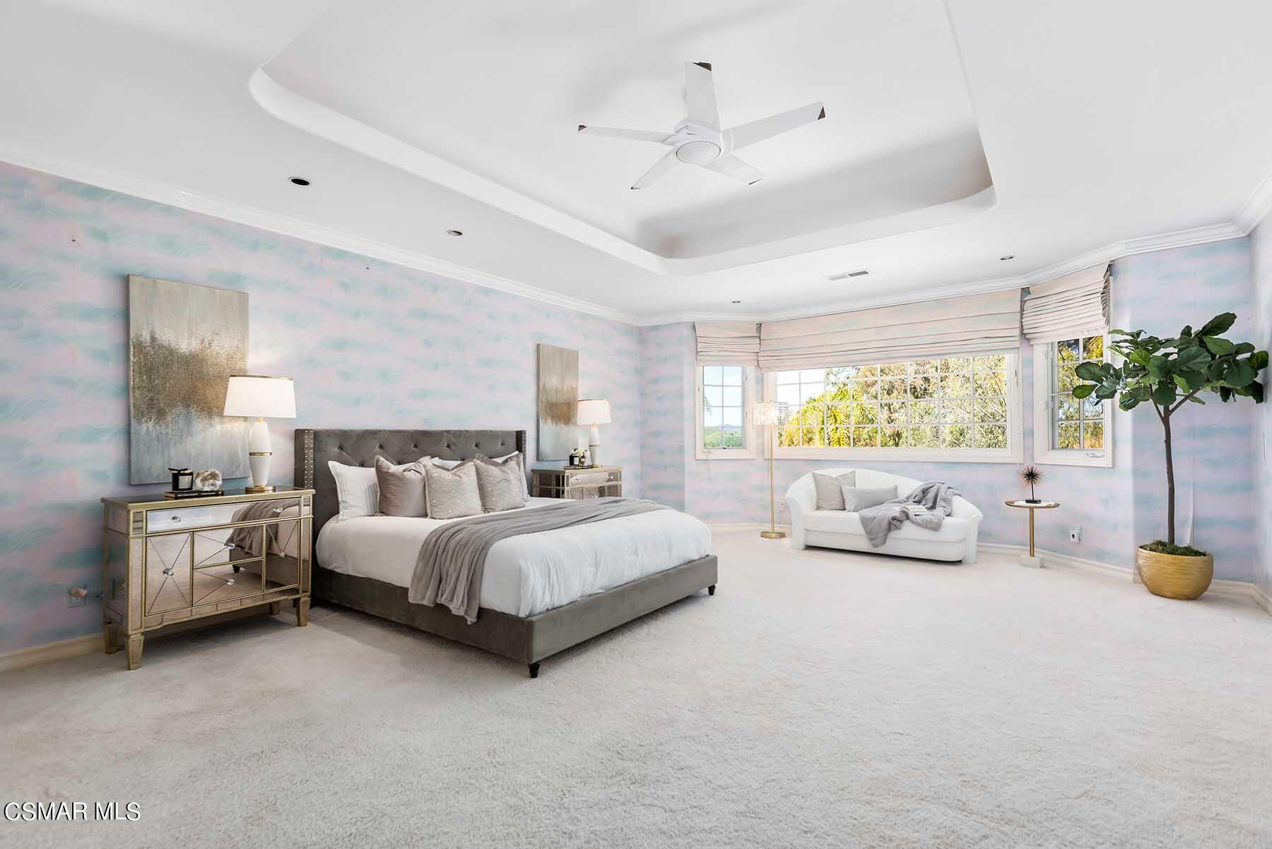 5467 Wellesley Drive Calabasas, CA 91302 - Photo 32 of 60 a spacious bedroom with a bed and potted plant