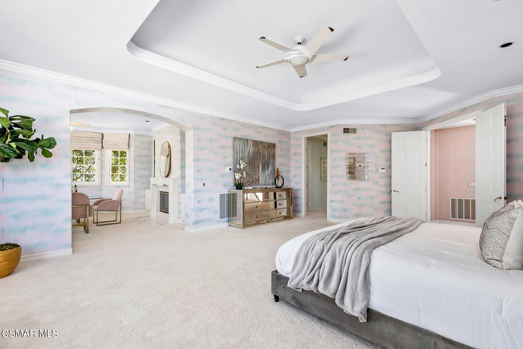 5467 Wellesley Drive Calabasas, CA 91302 - Photo 34 of 60 a spacious bedroom with a bed and ceiling fan