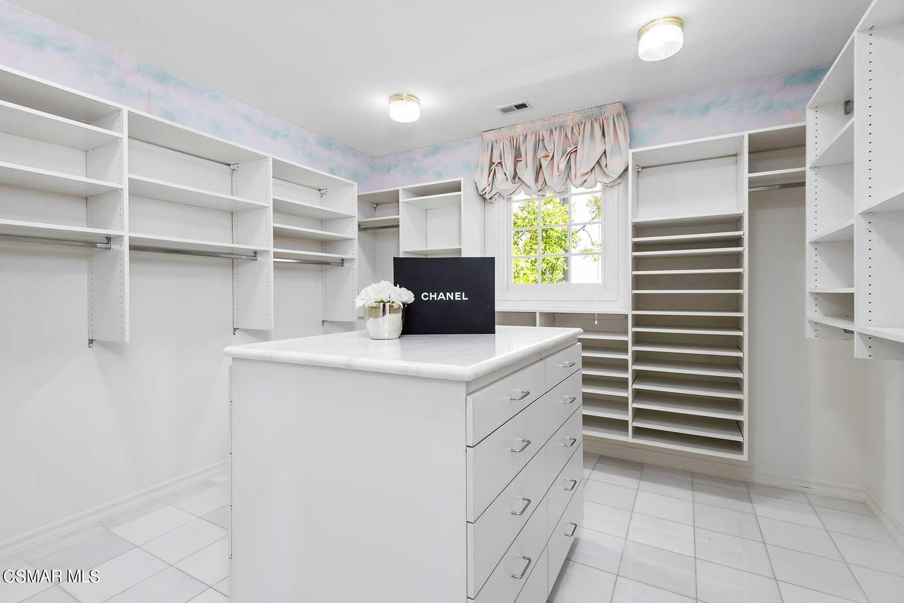5467 Wellesley Drive Calabasas, CA 91302 - Photo 37 of 60 a kitchen with a stove a sink and a window