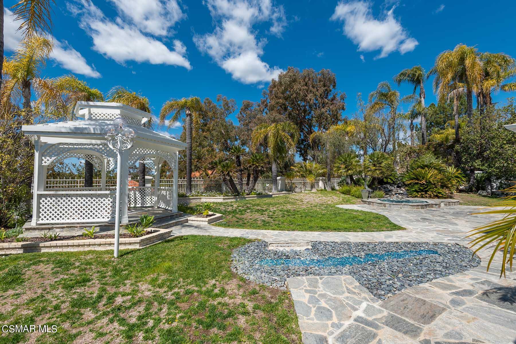5467 Wellesley Drive Calabasas, CA 91302 - Photo 44 of 60 a view of a park with swings and slides
