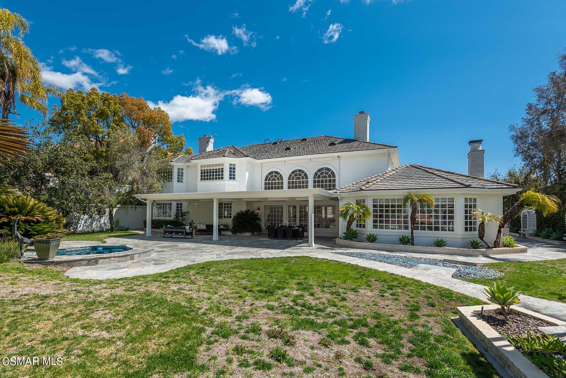 5467 Wellesley Drive Calabasas, CA 91302 - Photo 45 of 60 a front view of a building with a yard
