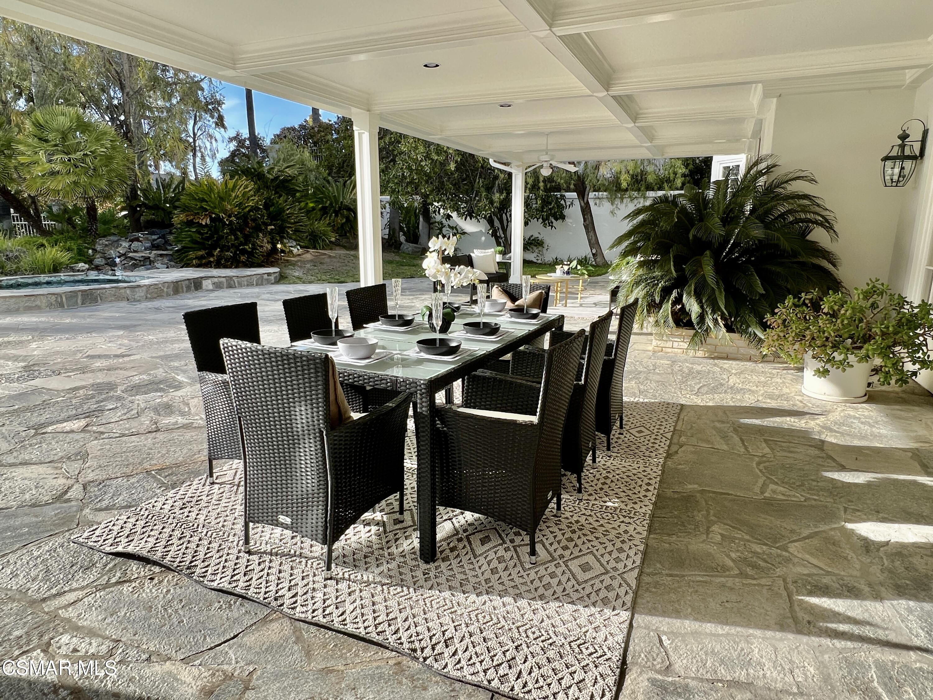 5467 Wellesley Drive Calabasas, CA 91302 - Photo 48 of 60 a view of an outdoor dining space with furniture