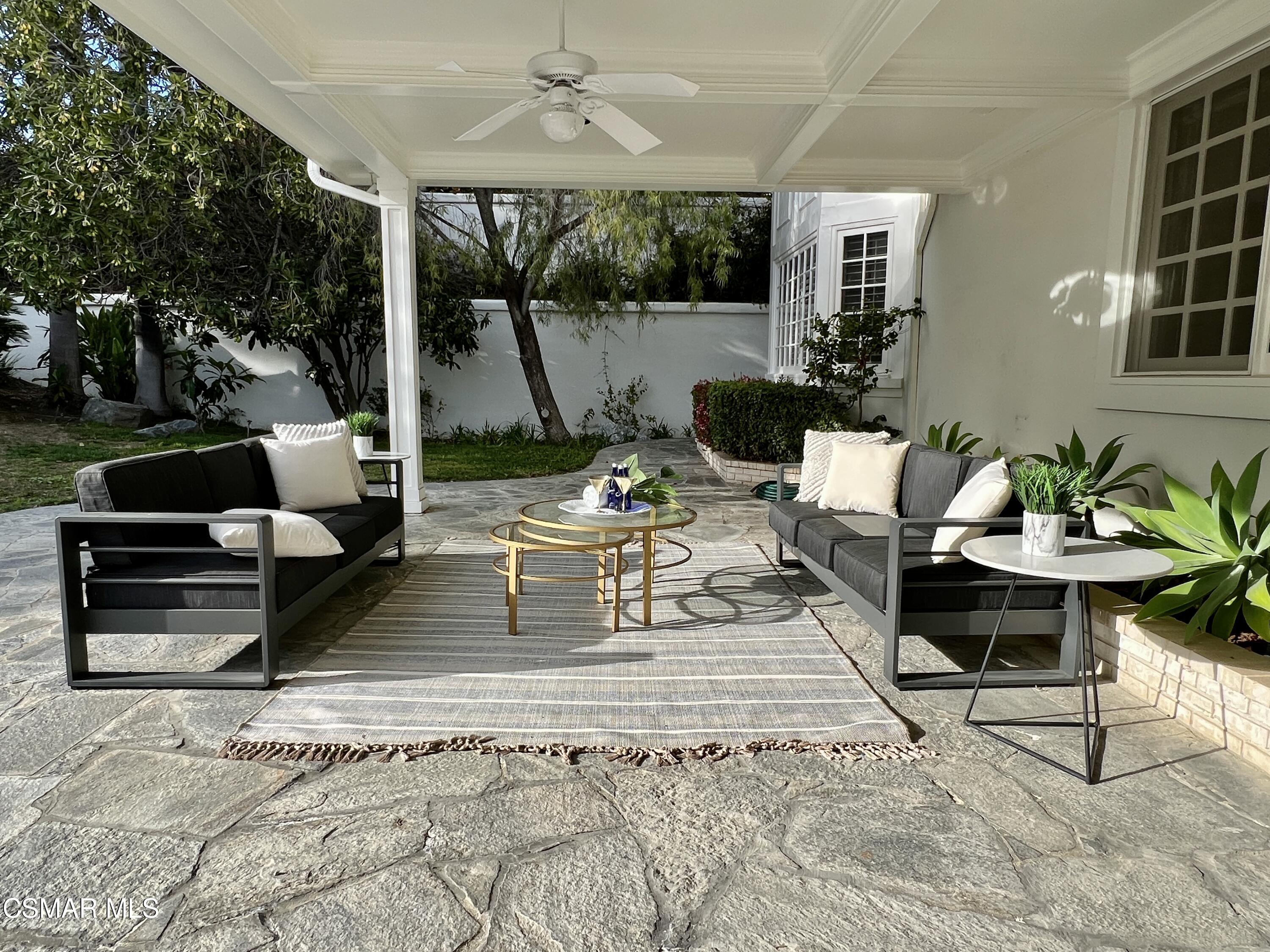 5467 Wellesley Drive Calabasas, CA 91302 - Photo 50 of 60 a view of a patio with couches chairs and a potted plant