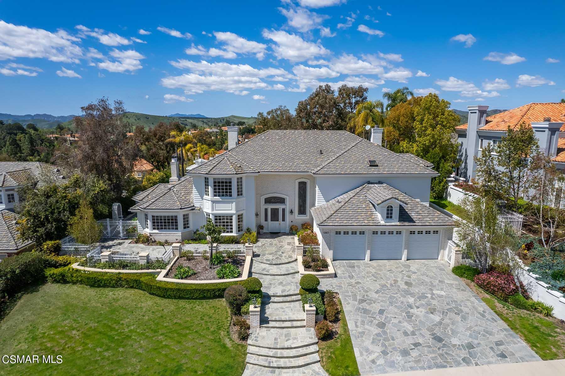 5467 Wellesley Drive Calabasas, CA 91302 - Photo 59 of 60 a front view of a house with garden