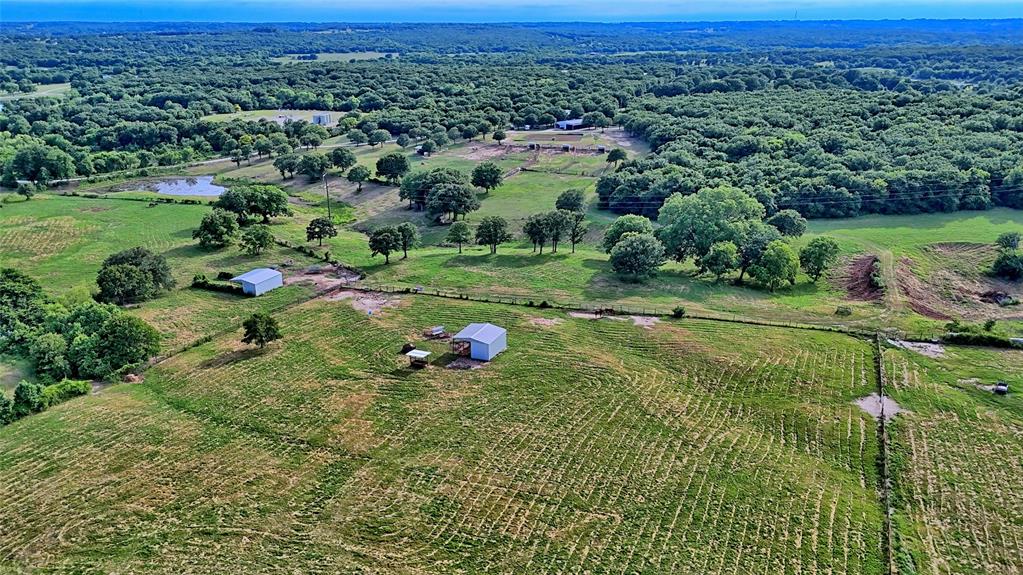 4509 Lazy E Road St. Jo, TX 76265 - Photo 36 of 39 an aerial view of a golf course with parking space