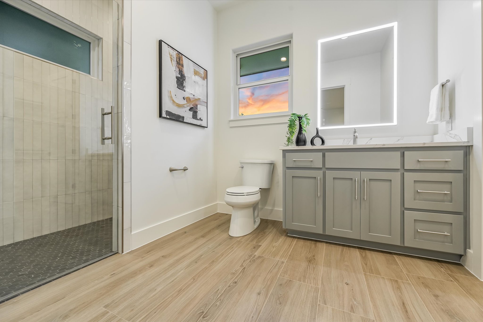 410 Shady Tree Drive Georgetown, TX 78633 - Photo 17 of 40 Full bath with vanity, a shower stall, and light wood-style flooring